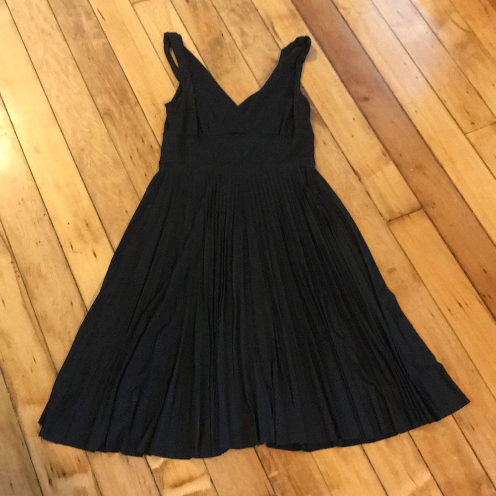 Black dress with full pleated skirt
